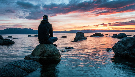 Man Sitting with Clouds