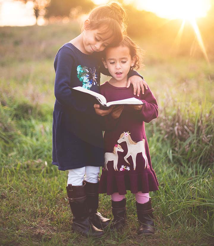 Two Girls Reading Outside